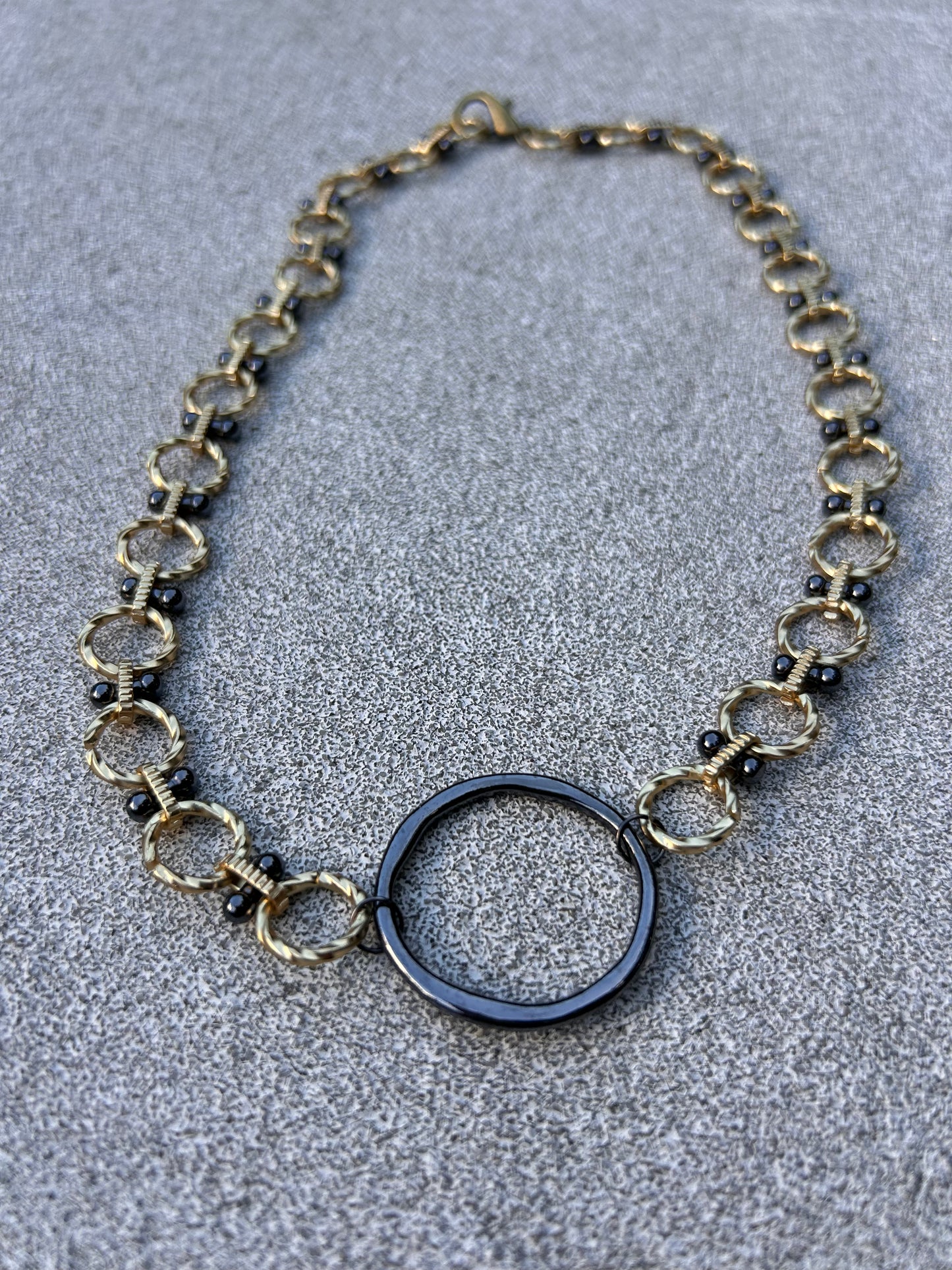 Ring of Fire - Gold Mixed Chain with a Gunmetal Ring
