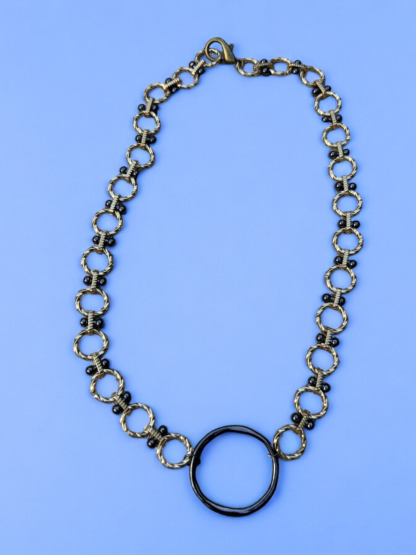 Ring of Fire - Gold Mixed Chain with a Gunmetal Ring