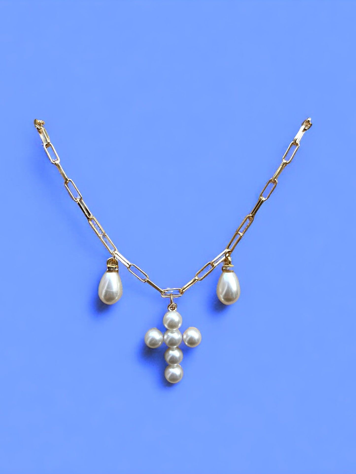 The Triple Pearl Cross